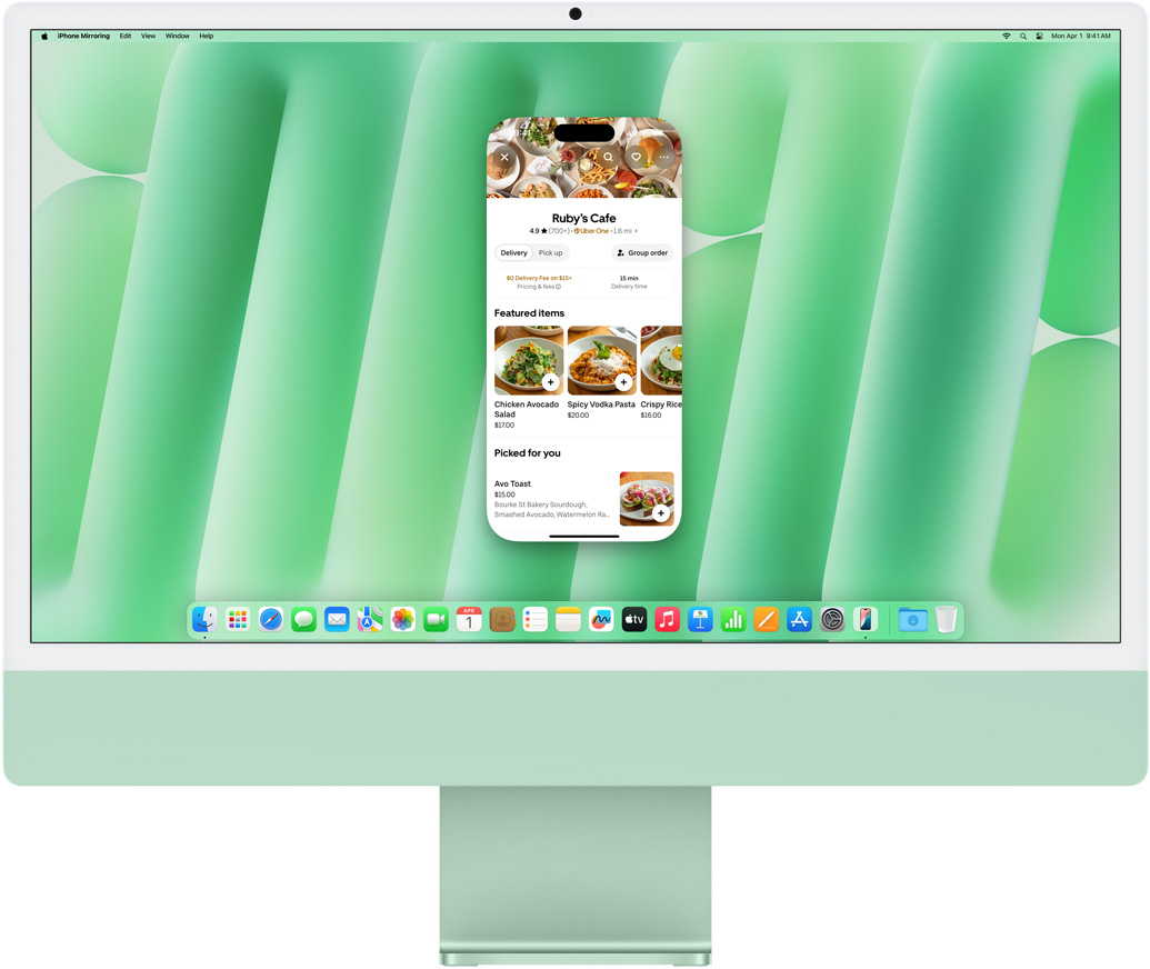 iPhone 鏡像輸出功能示範(fàn)。iPhone 螢?zāi)徽故镜?Uber Eats app 鏡像輸出至 iMac 並在 iMac 上操控。
