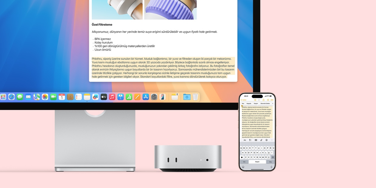 Mac monit?r, gümü? rengi Mac mini ve iPhone yan yana yerle?tirilmi?, monit?r ve iPhone’un ekran?nda i?eriklerin bir Apple ayg?t?ndan kopyalan?p di?erine yap??t?r?labilmesini sa?layan Evrensel Pano ?zelli?i g?steriliyor
