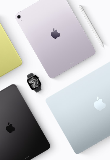 Imagem de cima de aparelhos Mac e iPad de cores diferentes, com um Apple Watch preto no centro