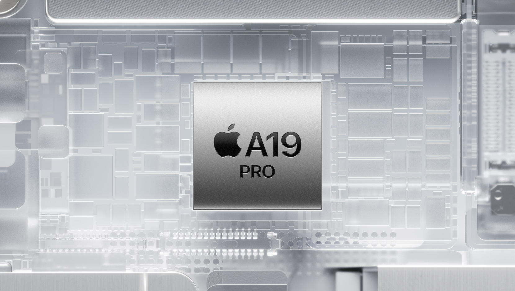Une puce A19 Pro entourée de composants lumineux à l’intérieur d’un iPhone