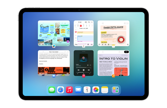 橫向放置的 iPad 螢?zāi)簧?，顯示六個(gè)視窗分成兩行並排展開(kāi)，包括日曆、備忘錄、Apple Music 和 Safari 等 app